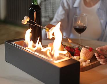 Ethanol Table Fireplace with People Roasting Marshmallows